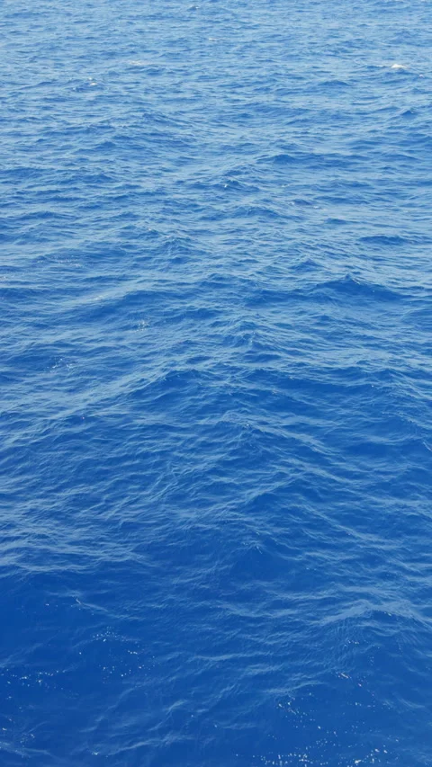 Deep blue Atlantic ocean surface, aerial flying over water waves natural 4K Video stock 295003762