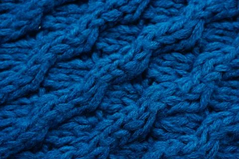 Deep blue background of large knitted thread pattern 스톡 사진