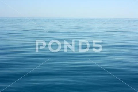 Deep blue calm sea ocean surface with calm waves Stock Photos