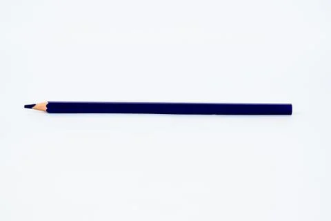 Deep blue colored sharp wood pencil crayon isolated on a white background Stock Photos