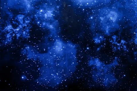 Deep blue cosmic space filled with stars and nebulae Foto stock
