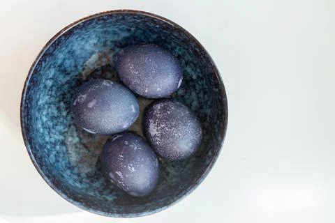 Deep Blue easter eggs in a bowl. Top view Stock Photos