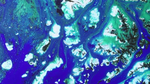 Deep blue liquid flowing past white icebergs, Flow Series 4. Abstract Stock Footage 136038316