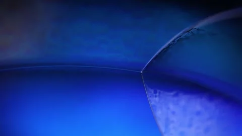 Deep blue liquid surface on black background Stock Footage 308864680