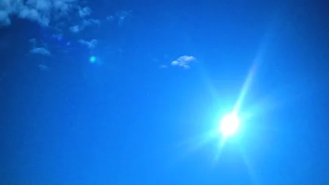 Deep Blue Night Sky and Fluffy Clouds with Tiny Twinkling Stars 스톡 동영상 345432002