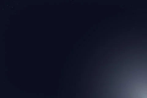Deep blue night sky background with soft white light flare in bottom corner.. 库存插图