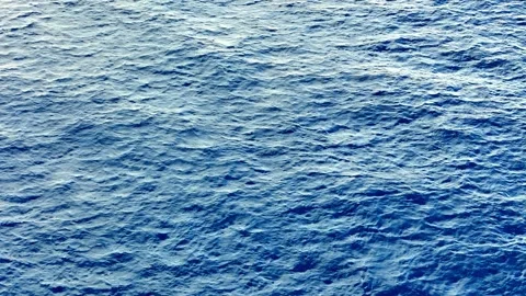 Deep Blue Ocean Ripples under Bright Daylight Shot from High Angle during Stock Footage 330911096