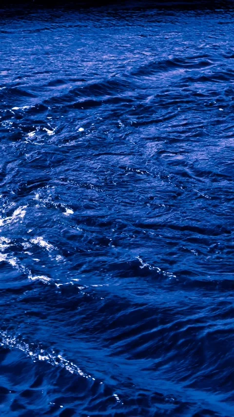 Deep blue ocean waves in slow motion with rich texture and movement. Vertical 4K Stock Footage 307012807