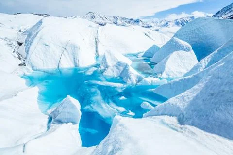 Deep blue pool of flooded ice cave on the Matanuska Glacier in Alaska's Chuga Stock Photos