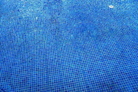 Deep blue pool water surface. Stock Photos