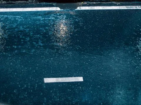 Deep Blue Rain Puddle Texture with Reflections, Abstract Wet Surface Closeup Stock Photos