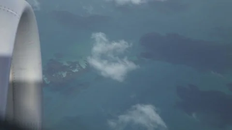 Deep blue sea in brazil shown from airplane window 스톡 동영상 127874777