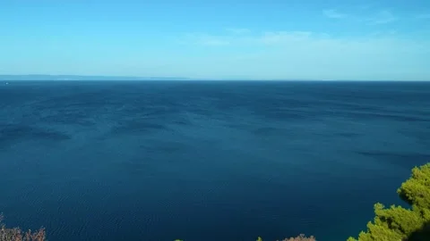 Deep blue sea stretches under clear sky. Chalkidiki, Greece Stock Footage 339019288