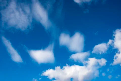 Deep Blue Skies &amp; fluffy clouds Stock Photos
