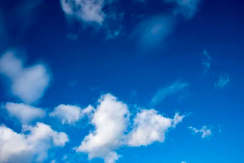Deep Blue Skies &amp; fluffy clouds Stock Photos