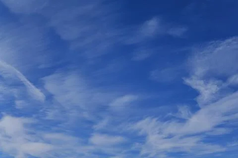 Deep blue skies with white clouds background with space for text, blue cloudy Stock Photos