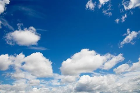 Deep blue skies with white clouds background Фото