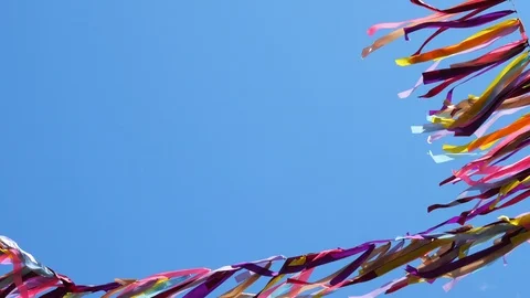 Deep blue sky and ribbons with various colors waving in wind. Stock Footage 111954548