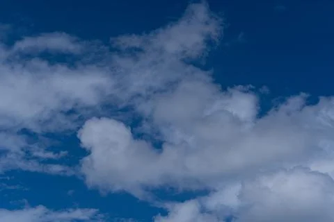 Deep Blue Sky with Fluffy White Cumulus Clouds Texture Photos