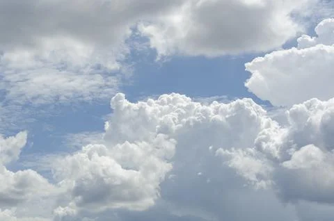 Deep blue sky with radiant clouds and light beams symbolizing hope and spir.. Stock Photos