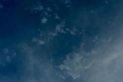 Deep blue sky with soft white clouds and delicate high altitude cloud formations Фото