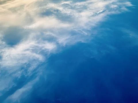 Deep Blue Sky with Soft White Clouds and Warm Sunlight Edge Jakarta Indonesia Stock Photos