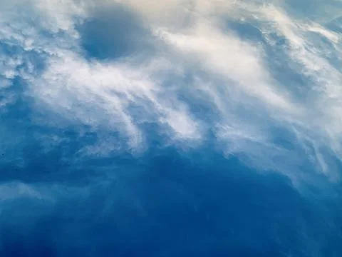 Deep Blue Sky with Soft White Clouds and Warm Sunlight Edge Jakarta Indonesia Stock Photos