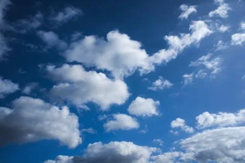 Deep Blue Sky with White Clouds Stock Photos