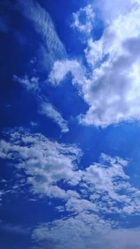 Deep Blue Sky with White Clouds Photos
