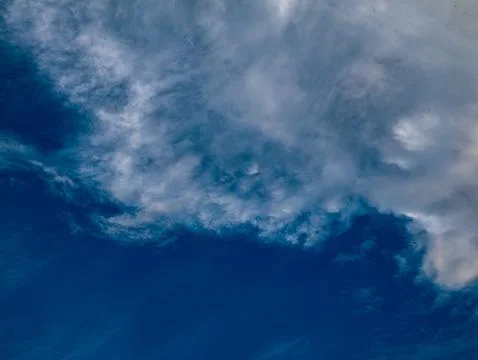 Deep Blue Sky with Wispy White Clouds Swirling Pattern, Horizontal Nature B.. Stock Photos