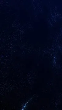 Deep blue starfield particle background with cosmic depth, abstract space t.. Stock Illustration