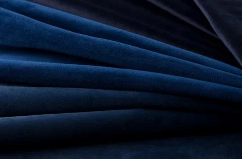 Deep blue velour textile sample. Fabric texture background Stock Photos