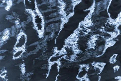 Deep blue water surface with abstract ripple pattern. Natural abstract back.. Stock Photos