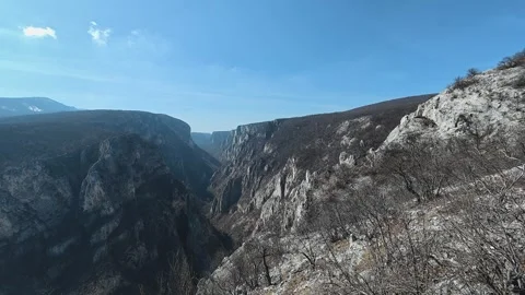 Deep canyon cuts through rugged stone walls. Balkan, Eastern Europe, POV Vídeos de archivo 331451099
