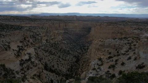 Deep Canyon desert overlooking sunset tilt shot looking down 4k 60fps SLOW M Stock Footage 135469434