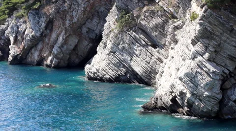 Deep clear Sea and high Cliffs Stock Footage 1019470