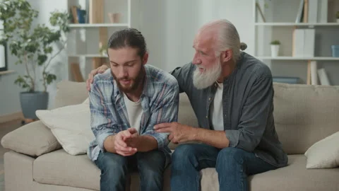Deep conversation between generations young man and elder, discuss life Stock Footage 263402778