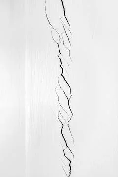 Deep crack in the corner of the room. White wall cracked. Problems of const.. Stock Photos