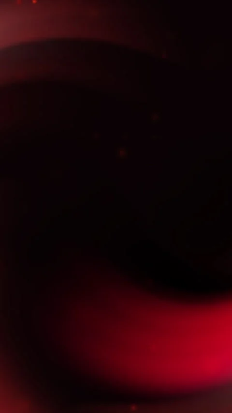 Deep crimson glow pulses softly against darkness Stock Footage 331925320