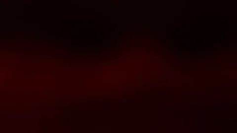 Deep crimson gradient background with subtle light effects, ideal for dramatic Stock Footage 317130626