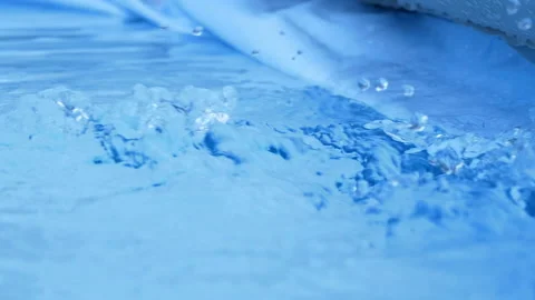 Deep crystal clear blue icy water stream close up Stock Footage 132414443