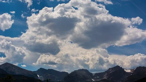 Deep Dark Harsh Lighting on Triple Mountain Peaks With Massive Clouds Time La Stock Footage 128936679