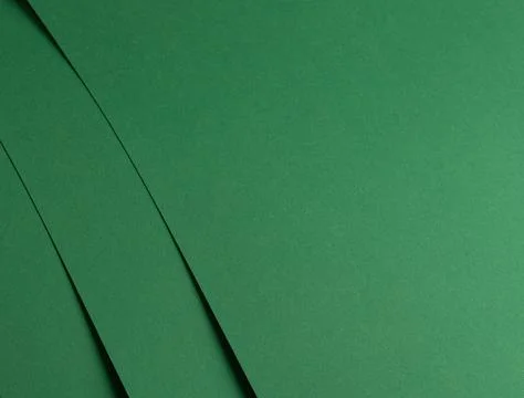 Deep emerald green paper background with a smooth texture and subtle folds... Stock Photos