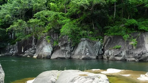 Deep Emerald River Pool by Steep Rocky Cliffs and Jungle 스톡 동영상 344232602