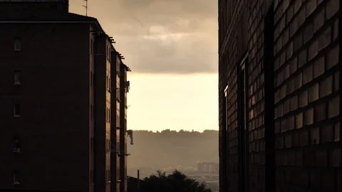 Deep evening sunset above the multistorey red brick residential buildings with 動画素材 92576358