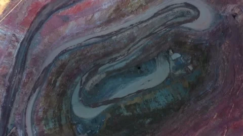 Deep excavated open pit copper mine in Cobar up to distant town as 4k. Stock Footage 168331658