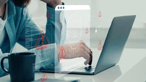 Deep fake technology raises concerns while a person works on a laptop Stock Photos