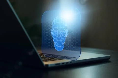 Deep fake technology shows a digital face model on a laptop screen in a dark Stock Photos