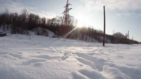 Deep footprints in the snow in a field near the forest belt Stock Footage 59758258