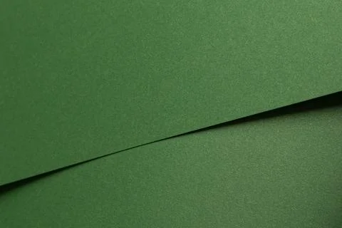 Deep forest green paper background with a smooth matte texture and subtle Stock Photos